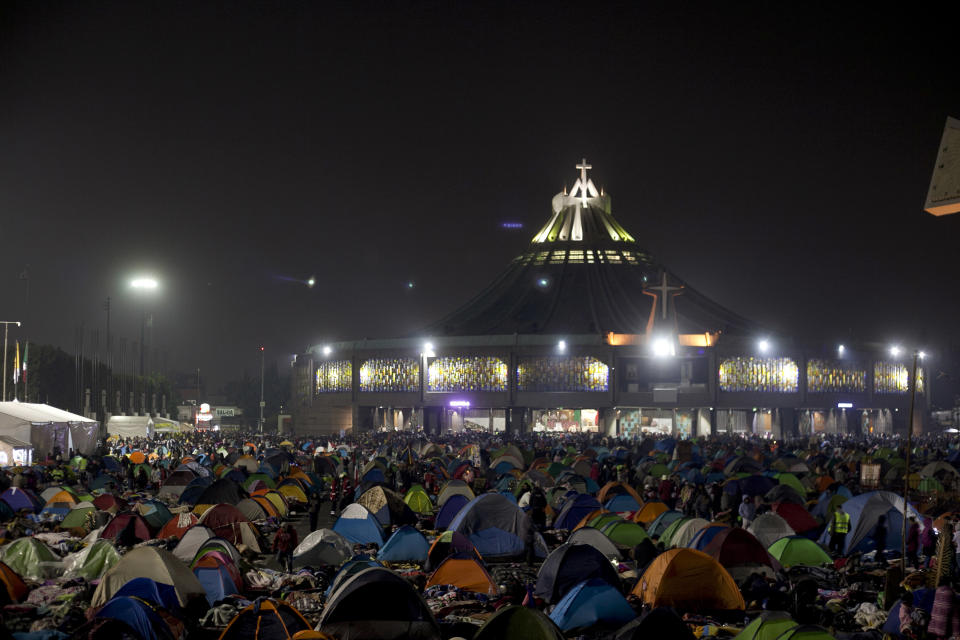 Tents cover the plaza outside the Basilica of Guadalupe in Mexico City, Wednesday, Dec. 12, 2018. Hundreds of thousands of people from all over the country converge on Mexico's holy Roman Catholic site, many bringing with them images or statues of Mexico's patron saint to be blessed, marking the Virgin's annual feast day. (AP Photo/Oswaldo Ramirez)