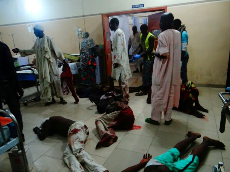 Injured victims of a female suicide bomber lie on the floor awaiting medical attention as beds were no longer available at a Maiduguri hospital in northeastern Nigeria