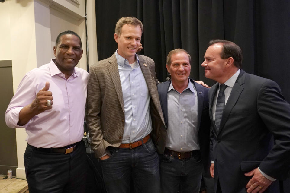 (L-R) Utah Rep. Burgess Owens, Utah Rep. Blake Moore, Utah Rep. Chris Stewart and U.S. Sen. Mike Lee pose for pictures during an Utah Republican election night party on June 28, 2022, in South Jordan, Utah. (AP Photo/George Frey)