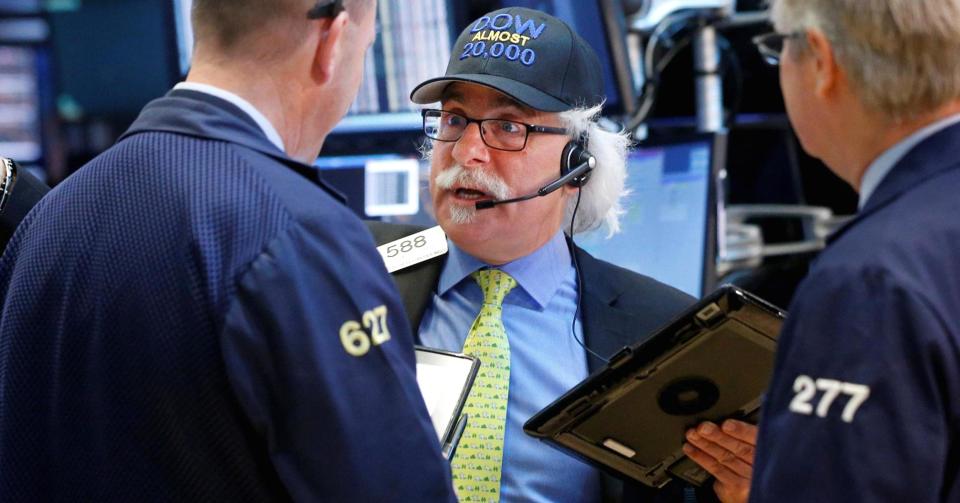 Traders trade on the NYSE floor.