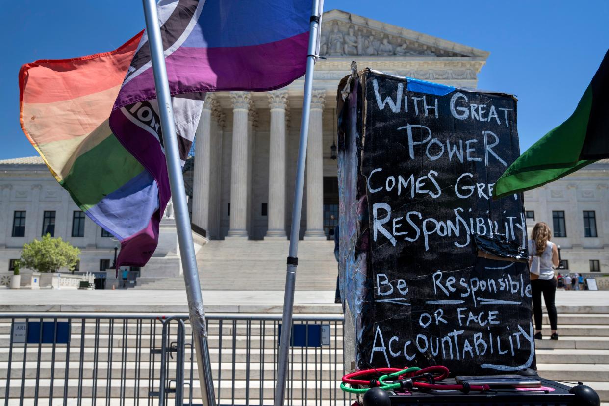 Flags and signs join protests outside the Supreme Court on Friday as Americans await a decision in an abortion drug case with national implications. (AP)