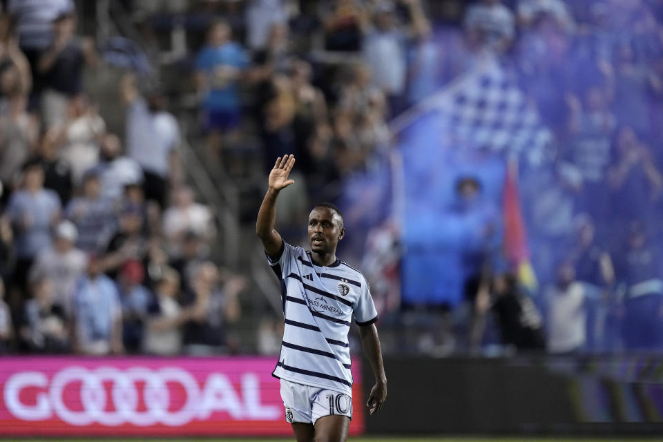 Sporting Kansas City midfielder Gadi Kinda waves to fans after scoring a goal during the first half of an MLS soccer match against FC Dallas Wednesday, May 31, 2023, in Kansas City, Kan. (AP Photo/Charlie Riedel)