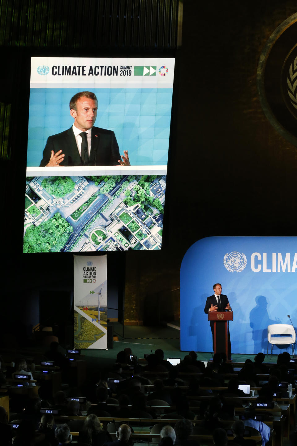 France's President Emmanuel Macron addresses the Climate Action Summit in the United Nations General Assembly, at U.N. headquarters, Monday, Sept. 23, 2019. (AP Photo/Jason DeCrow)