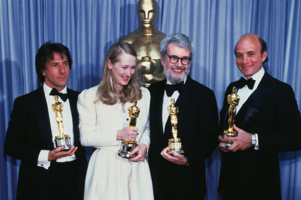 The big winners of the movie, Kramer vs. Kramer, hold up four of the Oscars won by the film at the 52nd Annual Award presentations. (AP)