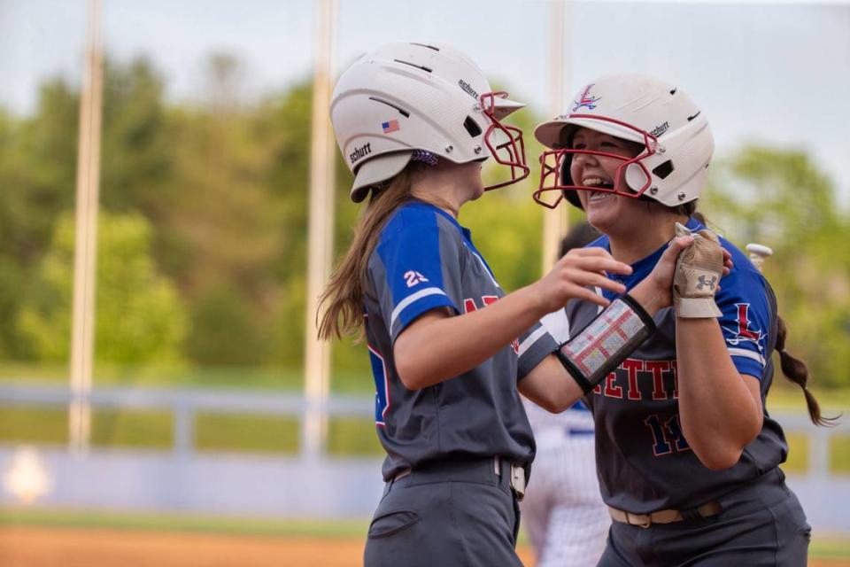 Claire Cronan (11) of the Lafayette Generals celebrates after scoring against the North Laurel Lady Jaguars with Anna Clay Denton (25) during the 2021 KHSAA State Softball Tournament at John Cropp Stadium in Lexington, Ky., Sunday, June 13, 2021.