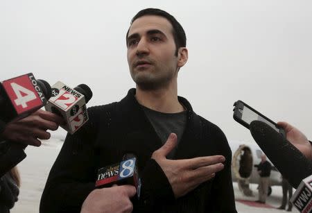 Former U.S. Marine Amir Hekmati, recently released from an Iranian prison, arrives at an airport in Flint, Michigan January 21, 2016. REUTERS/Rebecca Cook
