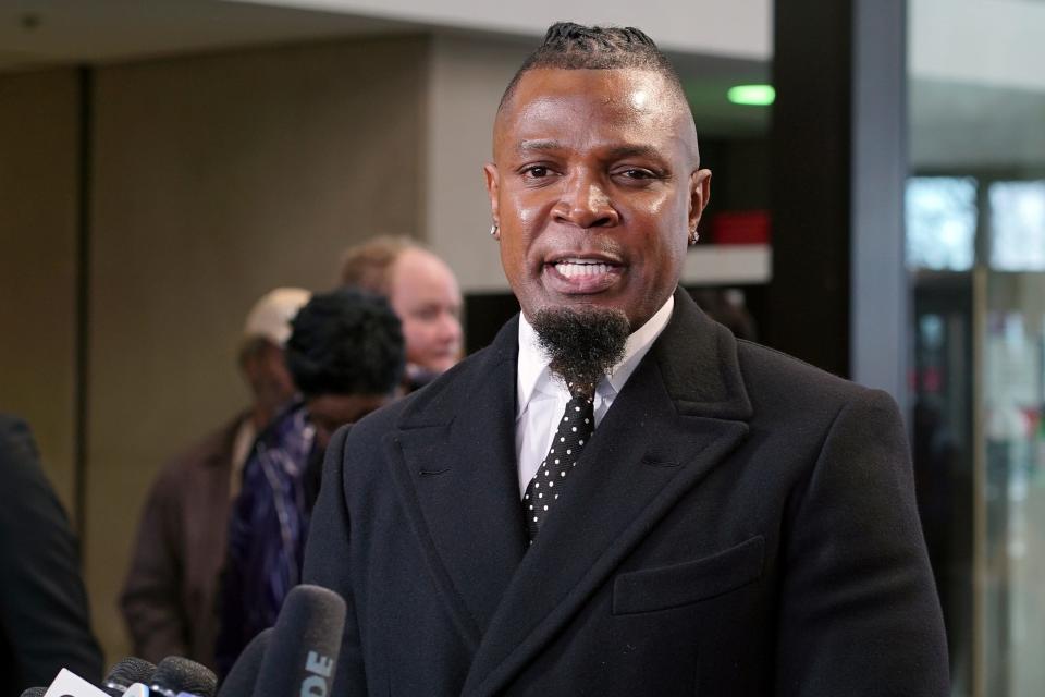 Darrell Johnson, publicist for R. Kelly, speaks to the media after R. Kelly appeared at court in Chicago on March 22, 2019.