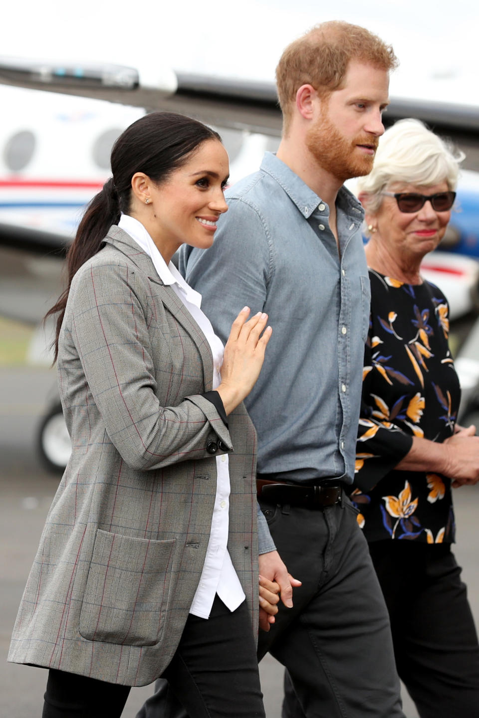 <p>Meghan did pair her blazer with $200 Aussie jeans by <a rel="nofollow noopener" href="https://www.outlanddenim.com.au/women/" target="_blank" data-ylk="slk:Outland Denim;elm:context_link;itc:0;sec:content-canvas" class="link ">Outland Denim</a> and a white shirt from Frech label Maison Kitsune. Photo: Getty </p>