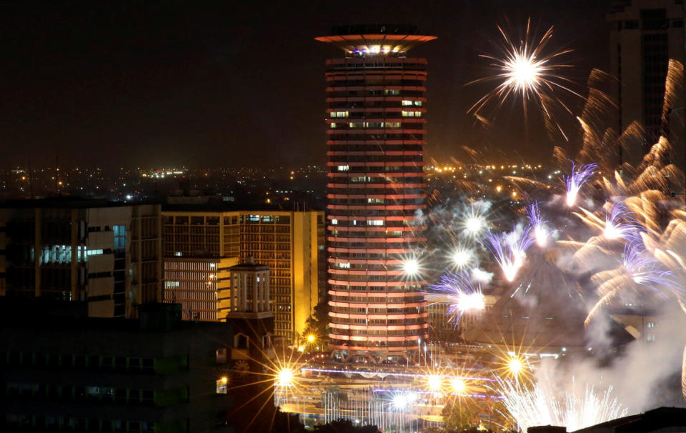 Fireworks explode over the Kenyatta International Convention Center square during New Year's celebrations in Nairobi, Kenya on January 1, 2018. (Photo: Thomas Mukoya / Reuters)