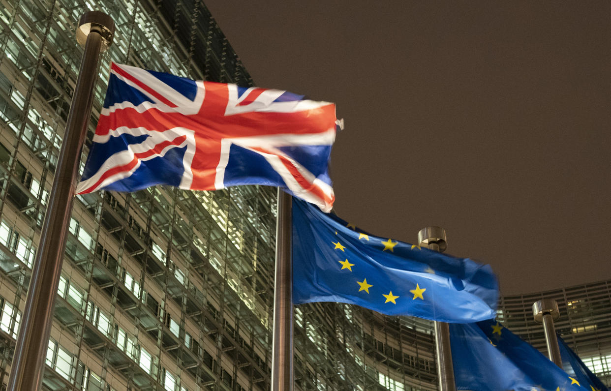 A British Union flag, also known as the Union Jack, left, flies beside European Union (EU) flags outside the headquarters of the European Commission, in Brussels, Belgium. Photographer: Jasper Juinen/Bloomberg