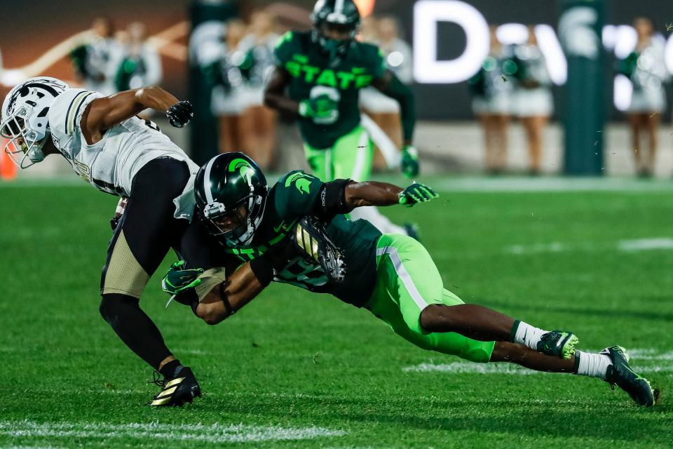 Michigan State cornerback Kalon Gervin tries to stop Western Michigan receiver DaShon Bussell during the first half at Spartan Stadium in East Lansing, Saturday, September 7, 2019.