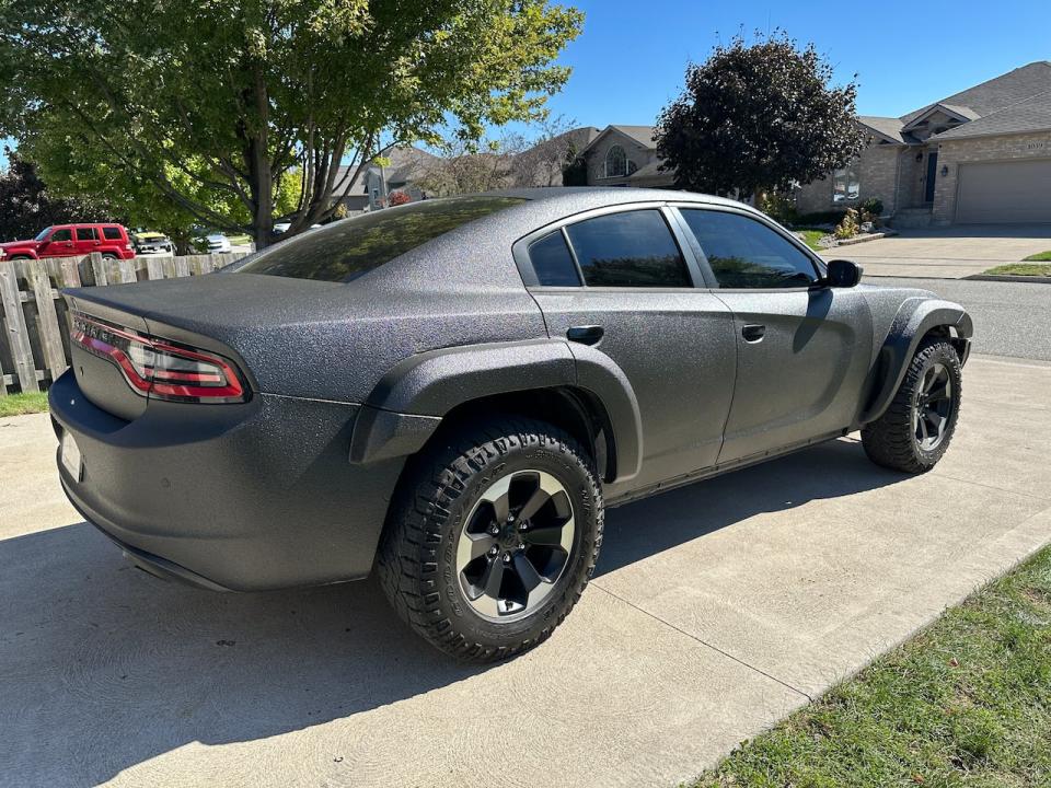 Lucas Kiewitz's personally customized Dodge Charger sits in his parents' driveway in Lakeshore.