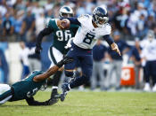 <p>Marcus Mariota #8 of the Tennessee Titans is defended by Jordan Hicks #58 of the Philadelphia Eagles during overtime at Nissan Stadium on Sept. 30, 2018 in Nashville, Tennessee. (Photo by Wesley Hitt/Getty Images) </p>