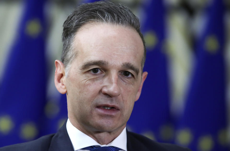 German Foreign Minister Heiko Maas speaks to the media as he arrives for a meeting of EU foreign ministers at the European Council building in Brussels, Monday, Feb 22, 2021. European Union foreign ministers on Monday will look at options for imposing fresh sanctions against Russia over the jailing of opposition leader Alexei Navalny as the 27-nation bloc considers the future of its troubled ties with the country. (Yves Herman, Pool via AP)