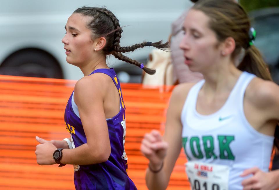 Rockton Hononegah's Kylie Simpson, left, runs to a 35th-place finish in the Class 3A girls state cross-country meet Saturday, Nov. 5, 2022 at Detweiller Park in Peoria.