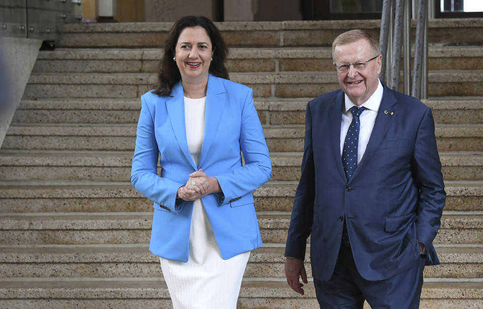 Queensland Premier Annastacia Palaszczuk, left, and AOC President John Coates attend a media conference following news Queensland's bid to host the 2032 Olympics was elevated to preferred bid by the IOC in Brisbane, Australia, Thursday, Feb. 25, 2021. An Australian push to host the 2032 Olympics was elevated overnight to the status of preferred bid, and the people of Brisbane and southeast Queensland state woke up to the news. (Darren England/AAP Image via AP)