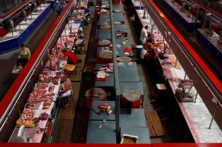 Vendors wait for customers at a meat market in Rostov-on-Don, Russia July 2, 2018. REUTERS/Murad Sezer