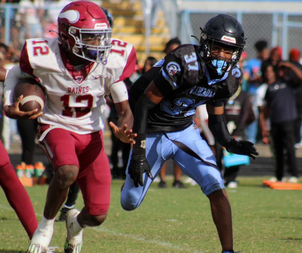 Raines defensive back Shareef Jackson (12) tries to escape Ribault's coverage unit on his way to a kickoff return touchdown during the Northwest Classic.