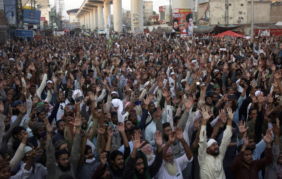 Supporters of Tehreek-e-Labaik Pakistan, a radical Islamist political party, chant religious slogans during a sit-in protest demanding release of their leader Saad Rizvi, in Lahore, Pakistan, Thursday, Oct. 21, 2021. Thousands of Islamists are demanding the release of Rizvi, who was arrested in April amid protest against France over depictions of Islam's Prophet Muhammad. (AP Photo/K.M. Chaudary)