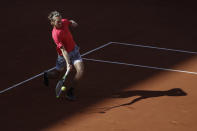Sebastian Korda of the U.S. plays a shot against Spain's Rafael Nadal in the fourth round match of the French Open tennis tournament at the Roland Garros stadium in Paris, France, Sunday, Oct. 4, 2020. (AP Photo/Alessandra Tarantino)
