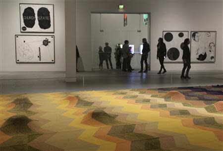 People view an exhibition of work by the late artist Mike Kelley during a media preview at The Geffen Contemporary at The Museum of Contemporary Art (MOCA) in Los Angeles, California March 28, 2014. REUTERS/Jonathan Alcorn