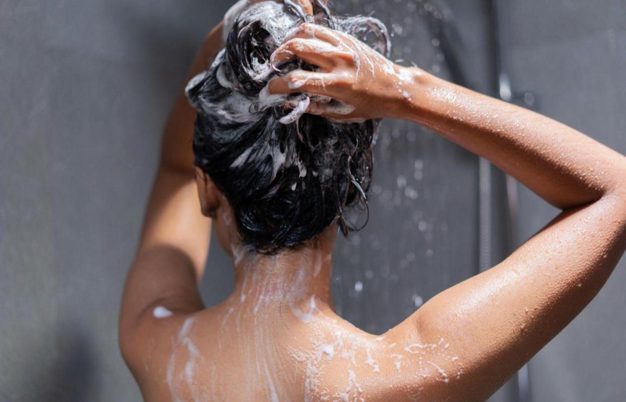 woman washing hair in the shower
