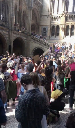 People are seen inside the Natural History Museum during the climate change protest in London, Britain April 22, 2019 in this still image taken from social media video. Fleur Anderson/via REUTERS