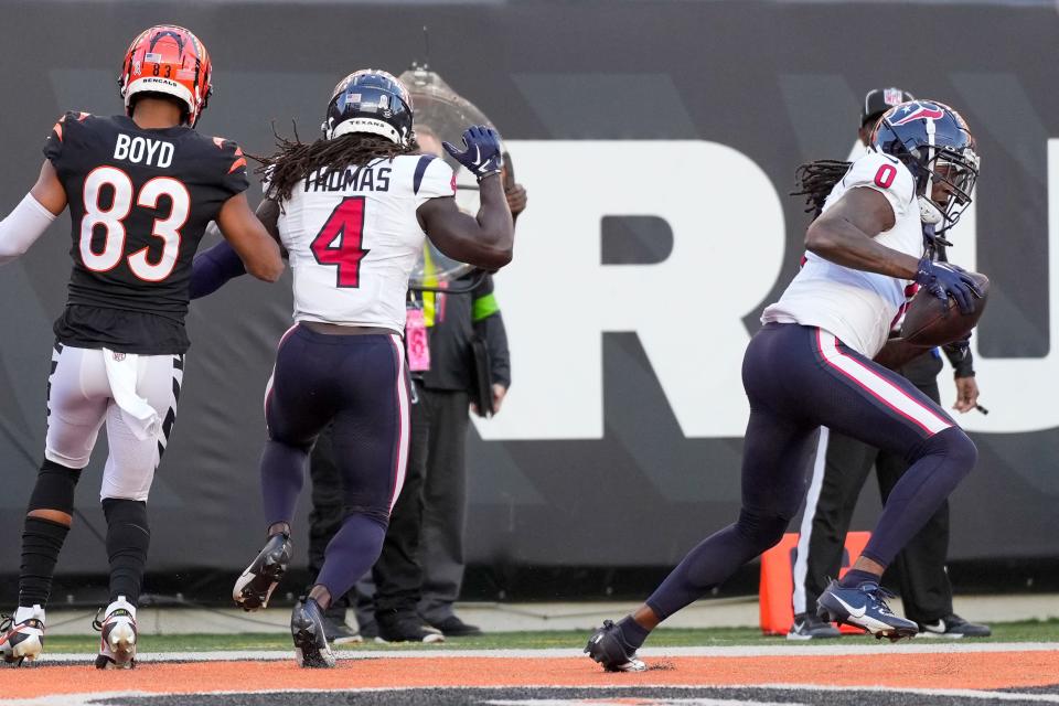 Houston Texans cornerback Shaquill Griffin (0) intercepts a pass intended for Cincinnati Bengals wide receiver Tyler Boyd (83) in the end zone in the fourth quarter of the NFL Week 10 game between the Cincinnati Bengals and the Houston Texans at Paycor Stadium in downtown Cincinnati on Sunday, Nov. 12, 2023.