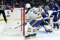 Buffalo Sabres left wing Zach Benson (9) scores past Tampa Bay Lightning goaltender Andrei Vasilevskiy (88) during the third period of an NHL hockey game Monday, April 15, 2024, in Tampa, Fla. (AP Photo/Chris O'Meara)