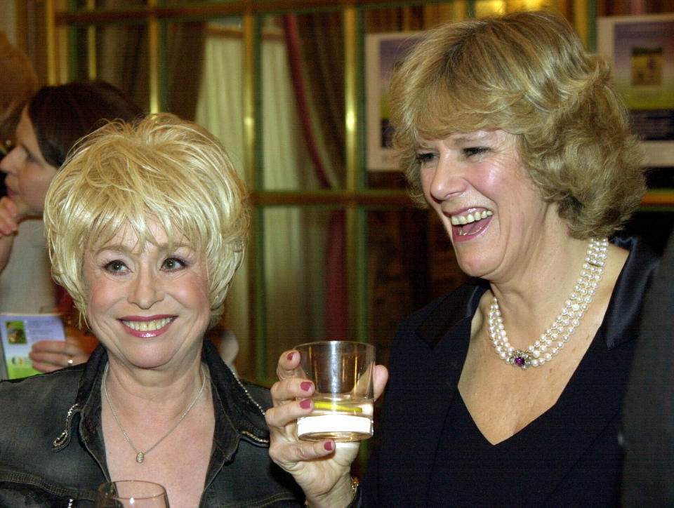 Camilla Parker Bowles (right) chats to actress Barbara Windsor during a reception at the Ritz Hotel in London. Mrs Barker Bowles, the long-term companion of the Prince of Wales, was carrying out her first public engagement as president of the National Osteoperosis Society.  *  and launching a guide to healthy living produced by the charity, which is dedicated to fighting the fragile bone disease.  Mrs Parker Bowles wrote the forward for the palm-sized book, called 'A Skeleton Guide to a Healthy You, Vitamins and Minerals'. 