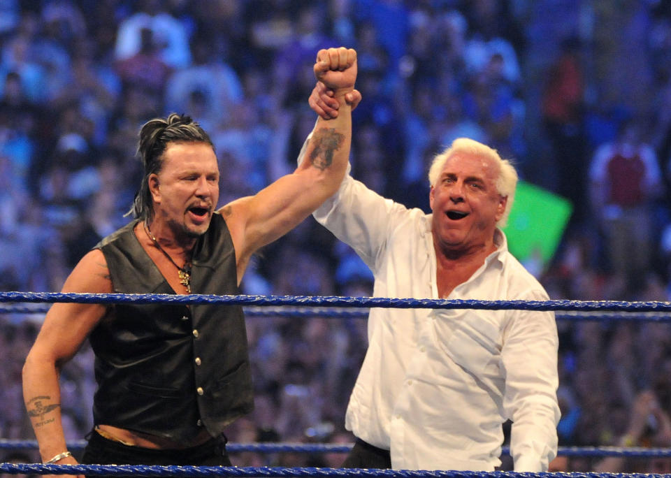 <p>“Nature Boy” Ric Flair raises the arm of actor Mickey Rourke after he knocked out Chris Jericho at WrestleMania 25 at the Reliant Stadium on April 5, 2009 in Houston, Texas. (Photo by George Napolitano/FilmMagic) </p>