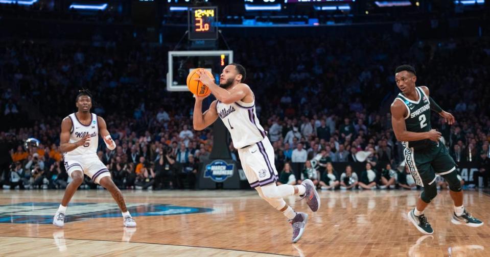 Kansas State’s Markquis Nowell makes an off-balance three-pointer just before the shot clock expired during the second half of a Sweet 16 win over Michigan State at Madison Square Garden on Thursday night.