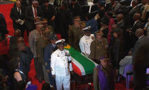 The coffin of former South African President Nelson Mandela is carried by military personnel at the end of his funeral service in his ancestral village of Qunu in the Eastern Cape province, 900 km (559 miles) south of Johannesburg, in this still image taken from December 15, 2013 video courtesy of the South Africa Broadcasting Corporation (SABC). REUTERS/SABC via Reuters TV (SOUTH AFRICA - Tags: POLITICS OBITUARY) ATTENTION EDITORS - FOR EDITORIAL USE ONLY. NOT FOR SALE FOR MARKETING OR ADVERTISING CAMPAIGNS. NO SALES. NO ARCHIVES. SOUTH AFRICA OUT. NO COMMERCIAL OR EDITORIAL SALES IN SOUTH AFRICA. THIS PICTURE WAS PROCESSED BY REUTERS TO ENHANCE QUALITY