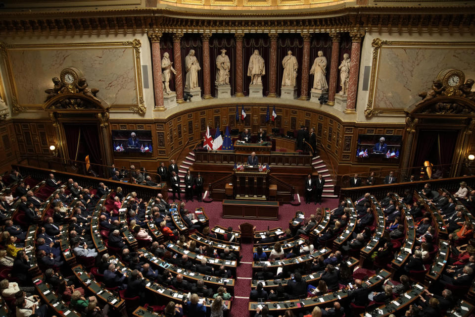 Britain's King Charles III addresses lawmakers from both the upper and the lower house of parliament at the Senate, Thursday, Sept. 21, 2023 in Paris. King Charles III will meet with sports groups in the northern suburbs of Paris and pay a visit to fire-damaged Notre-Dame cathedral Thursday, on the second day of his state visit to France. (AP Photo/Christophe Ena)