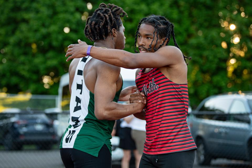 North Salem's DeMari Thompson congratulates West Salem's Mihaly Akpamgbo on his wins in the 100 and 200 meters during the CVC Track and Field District Championships at McCulloch Stadium on Friday, May 10, 2024, in Salem.