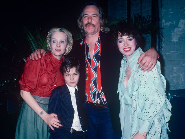 <p>Art Zelin/Getty</p> Mackenzie Phillips with her father John Phillips, brother Tamerlane, and Genevieve Waite circa 1980 in New York.