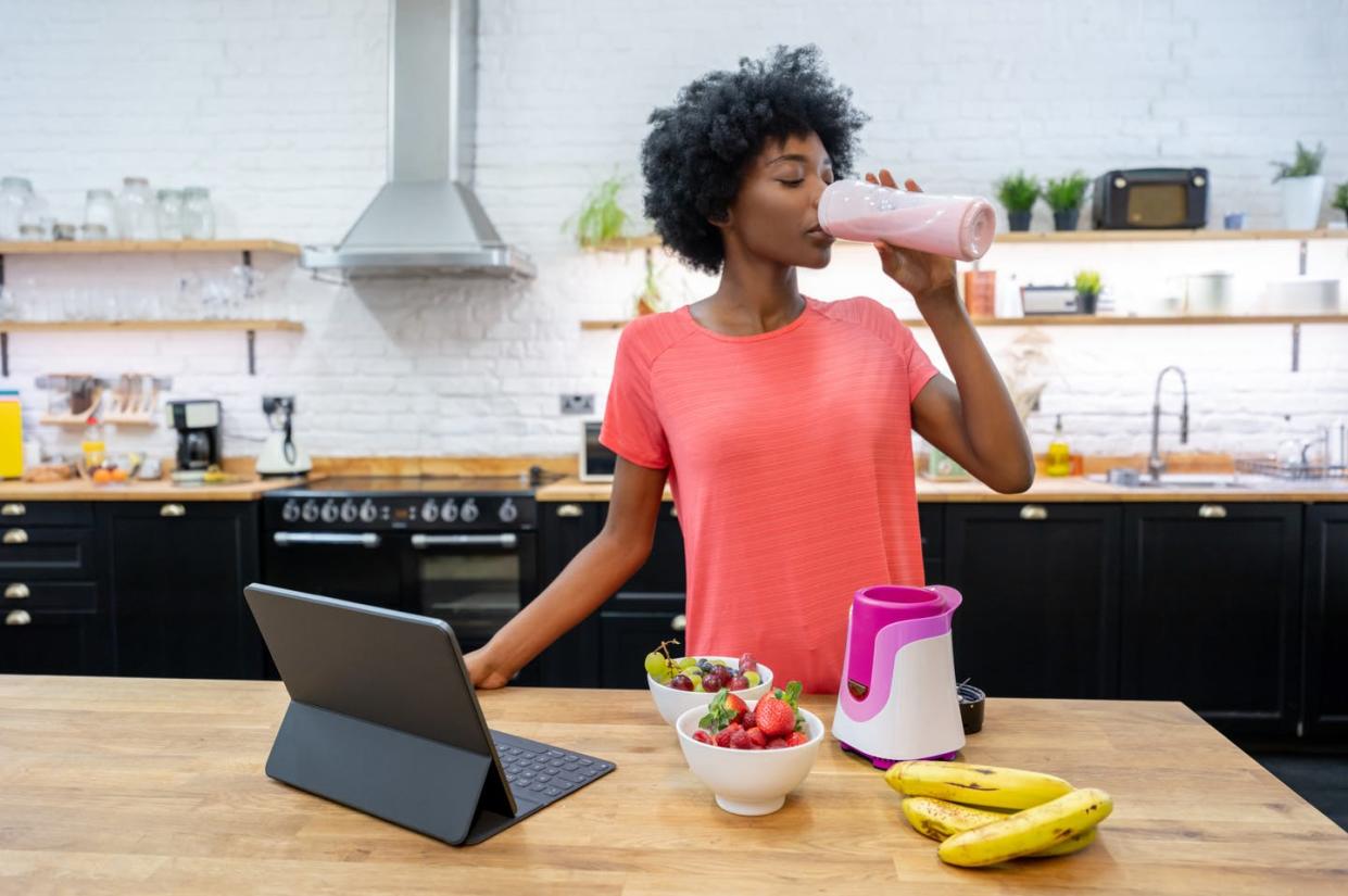 <span class="caption">A protein-rich shake is often the way many people try to get more of this nutrient into their diets.</span> <span class="attribution"><a class="link " href="https://www.gettyimages.com/detail/photo/african-american-woman-at-home-drinking-a-smoothie-royalty-free-image/1206327568?adppopup=true" rel="nofollow noopener" target="_blank" data-ylk="slk:andresr E+ via Getty Images;elm:context_link;itc:0;sec:content-canvas">andresr E+ via Getty Images</a></span>