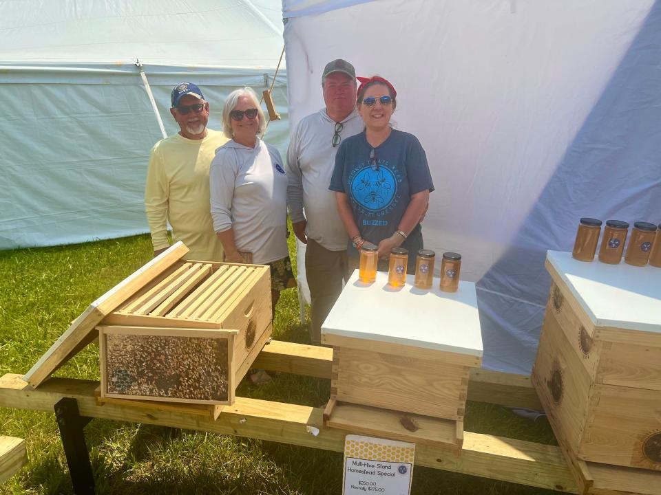 From left, Ron White, Donna Kirkwood, Stanley and Jennifer Evans of Whiskey Trail Bees were one of more than 200 vendors featured at the second annual Homestead Festival.