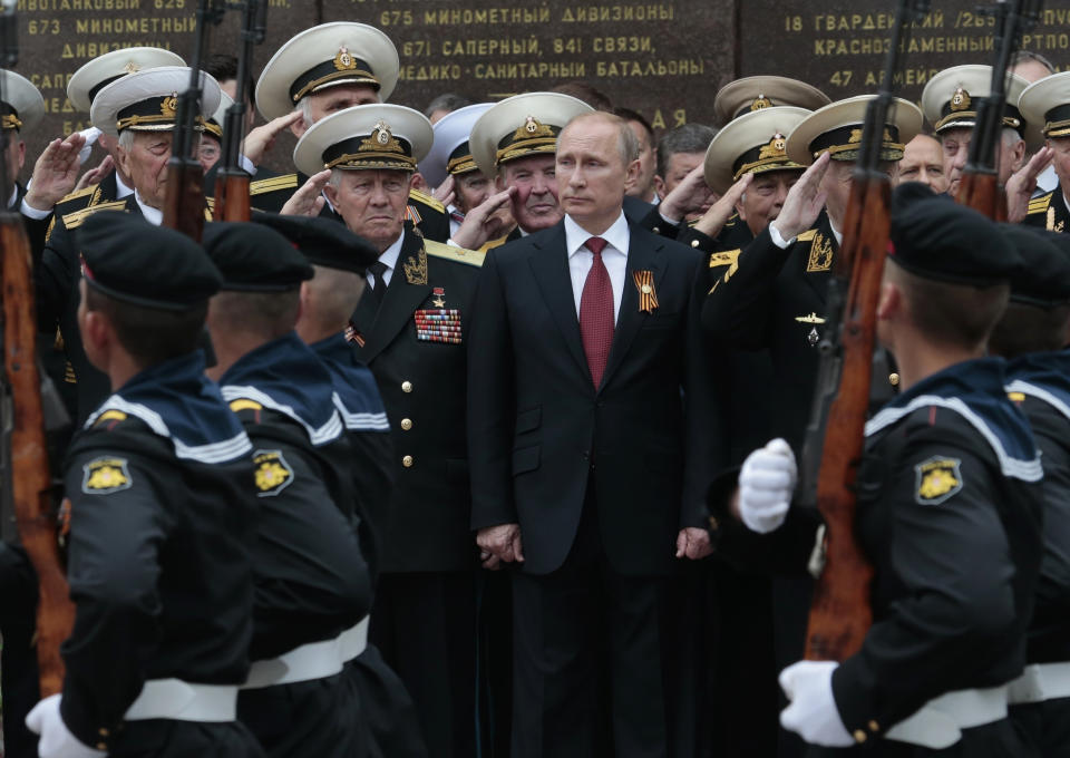FILE - Russian President Vladimir Putin attends a parade marking Victory Day in Sevastopol, Crimea, where the Russian Black Sea Fleet is based, on May 9, 2014. Moscow illegally annexed Crimea from Ukraine in March 2014, following the ouster of Ukraine's Russia-friendly president amid protests in Kyiv. (AP Photo/Ivan Sekretarev, File)
