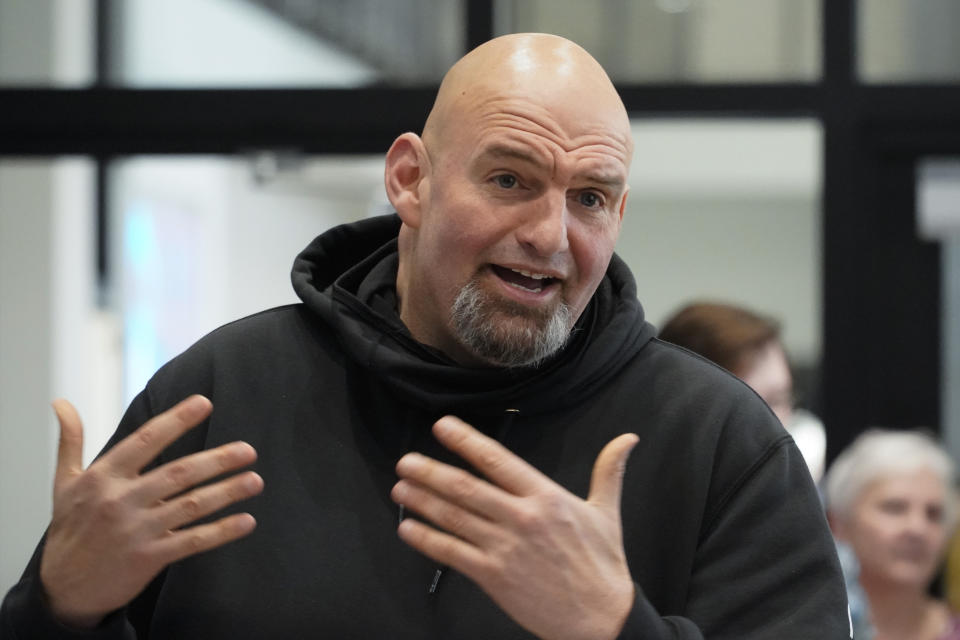 FILE - Pennsylvania Lt. Gov. John Fetterman visits with people attending a Democratic Party event for candidates to meet and collect signatures for ballot petitions for the upcoming Pennsylvania primary election, at the Steamfitters Technology Center in Harmony, Pa., March 4, 2022. Fetterman released the opening ads of his general election campaign last week just days after securing his party's Senate nomination. “The big guy is running for Senate to take on Washington,” the narrator says of Fetterman in one of the new ads. (AP Photo/Keith Srakocic, File)