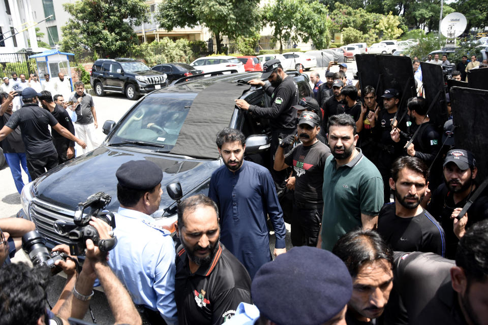 A vehicle carrying Pakistan's former Prime Minister Imran Khan arrives at Election Commission of Pakistan, in Islamabad, Pakistan, Tuesday, July 25, 2023. (AP Photo/W.K. Yousafzai)