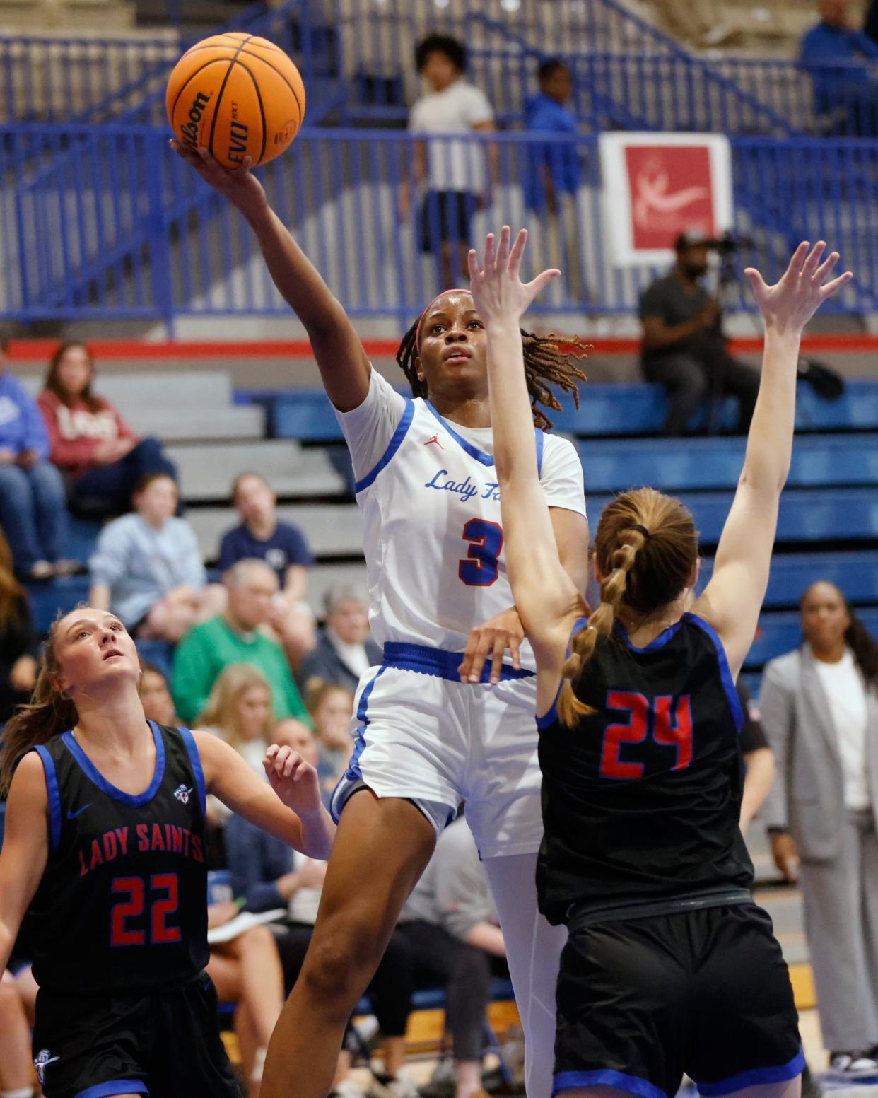 Millwood's Brandie Harrod (3) shoots between Ava McIntyre (24) and Rylee Roof (22) of OCS during a girls high school basketball game between Oklahoma Christian School and Millwood at the Millwood Field house in Oklahoma City, Tuesday, Feb. 6, 2024.