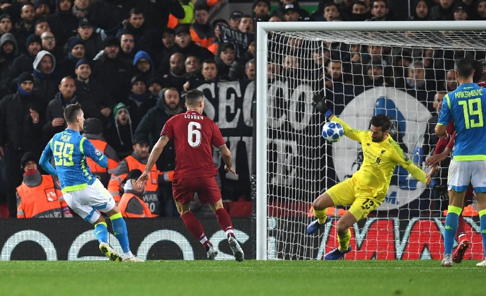 Liverpool’s Alisson Becker denies Napoli’s Arkadiusz Milik during their Champions League clash on 11 December, 2018. (PHOTO: AFP/Paul Ellis)