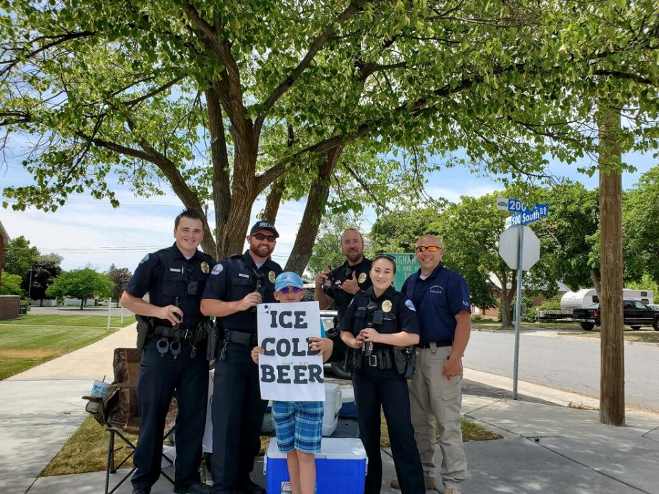 A young entrepreneur in Utah caught the attention of local authorities for an audacious sign advertising "ICE COLD BEER." (Credit: Brigham City Police Department)
