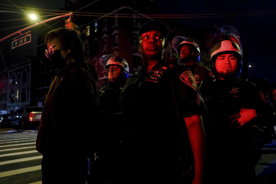 New York Police escort protesters onto a bus after making arrests during a standoff between police and demonstrators outside the City College of New York, Wednesday, May 1, 2024, in New York. (AP Photo/Julius Motal)