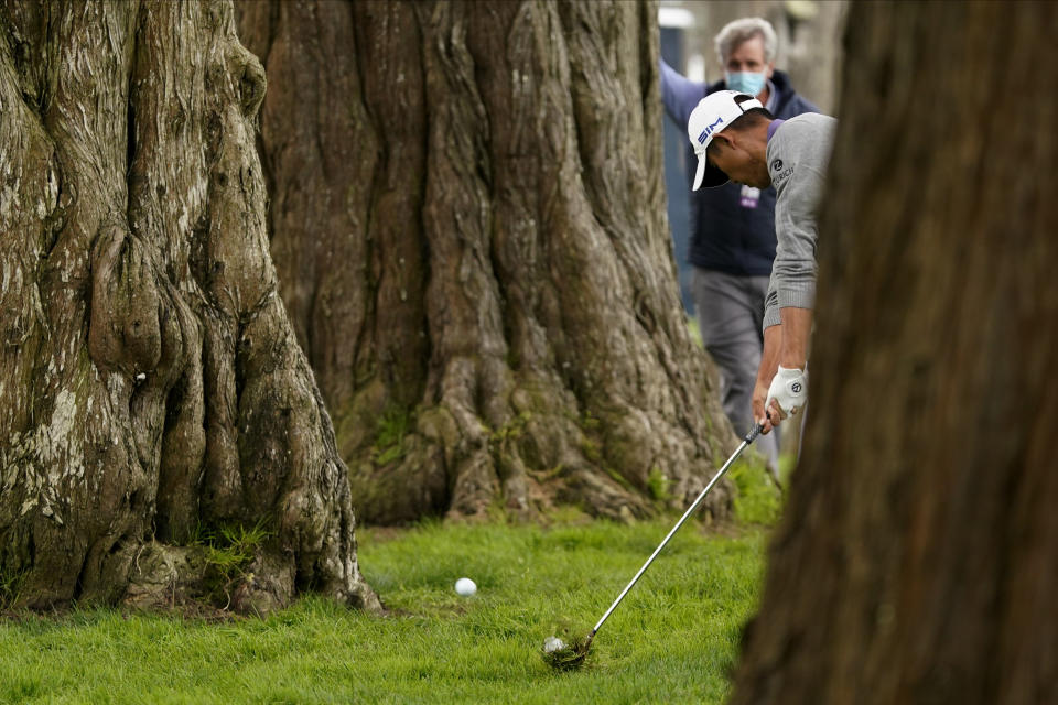 Collin Morikawa hits from the tress on the sixth hole during the final round of the PGA Championship golf tournament at TPC Harding Park Sunday, Aug. 9, 2020, in San Francisco. (AP Photo/Charlie Riedel)