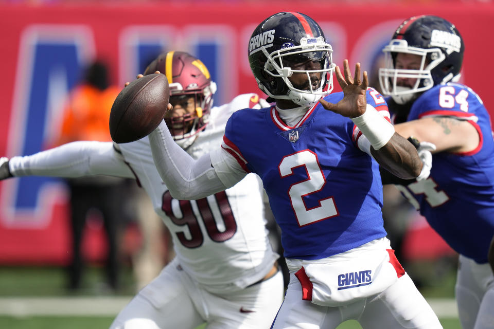 New York Giants quarterback Tyrod Taylor (2) passes against the Washington Commanders during the first quarter an NFL football game, Sunday, Oct. 22, 2023, in East Rutherford, N.J. (AP Photo/Seth Wenig)