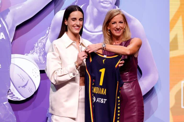 Caitlin Clark poses with WNBA Commissioner Cathy Engelbert after being selected first overall by the <a class="link " href="https://sports.yahoo.com/wnba/teams/indiana/" data-i13n="sec:content-canvas;subsec:anchor_text;elm:context_link" data-ylk="slk:Indiana Fever;sec:content-canvas;subsec:anchor_text;elm:context_link;itc:0">Indiana Fever</a> in the 2024 WNBA draft (Sarah Stier)