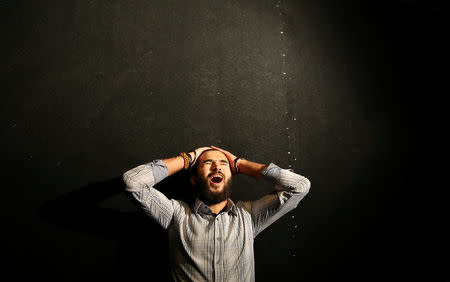 Ahmed Sharaf screams in a dark, soundproof room in an effort to relieve his frustrations and escape from the stresses of daily life in the new "scream room" inside a bookshop in Cairo, Egypt October 23, 2016. REUTERS/Mohamed Abd El Ghany