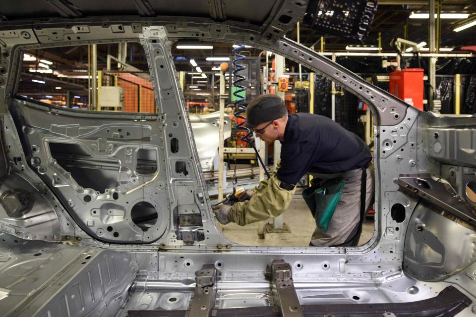 A member of Nissan's manufacturing staff: AFP via Getty Images